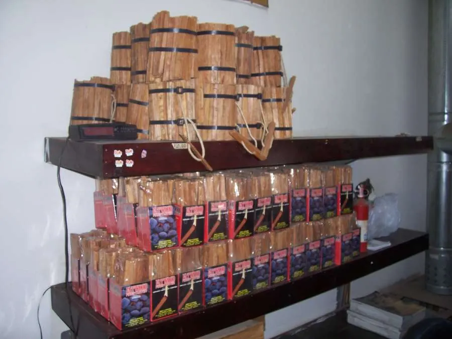 A shelf with many boxes of cigars on it